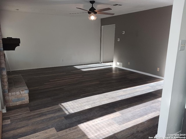 unfurnished room featuring ceiling fan and dark hardwood / wood-style flooring