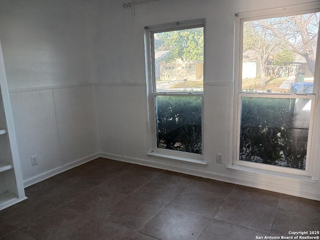 unfurnished room with a wealth of natural light