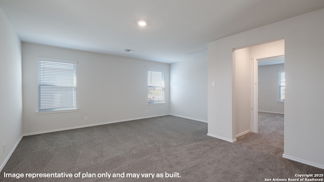 unfurnished room with carpet floors