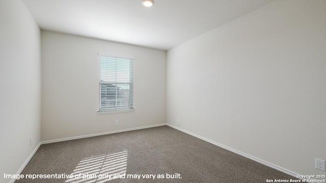 spare room featuring carpet