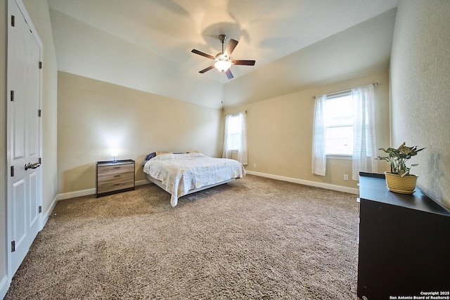 carpeted bedroom with ceiling fan and lofted ceiling