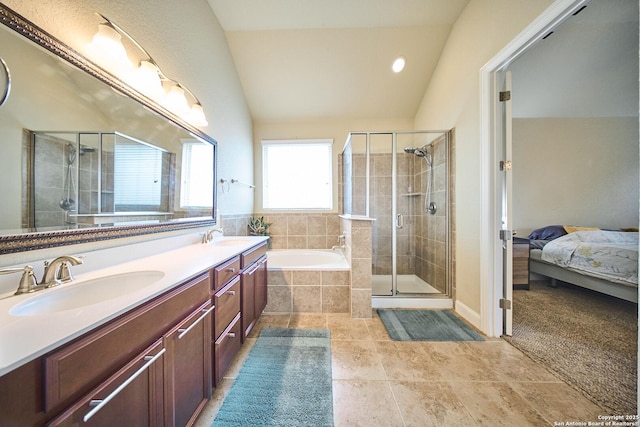 bathroom featuring tile patterned flooring, vanity, lofted ceiling, and plus walk in shower