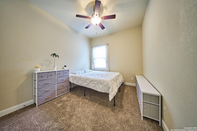 bedroom featuring ceiling fan and dark carpet