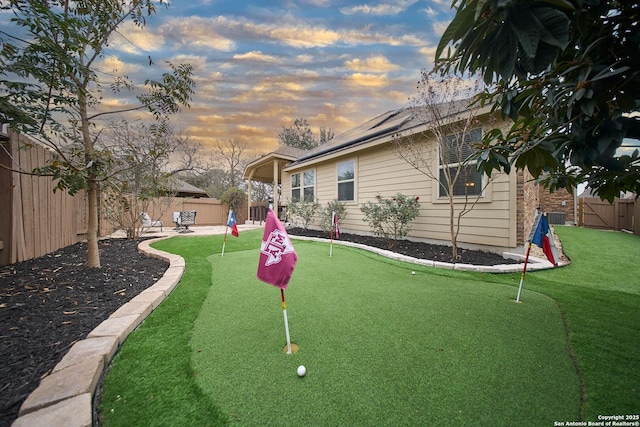 view of yard at dusk