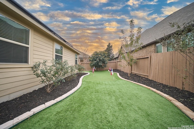 view of yard at dusk