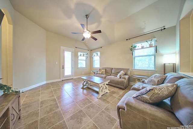 tiled living room with vaulted ceiling and ceiling fan