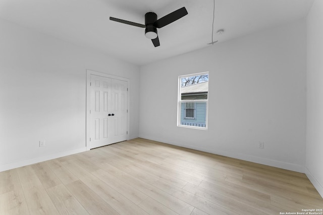 spare room featuring ceiling fan and light hardwood / wood-style floors