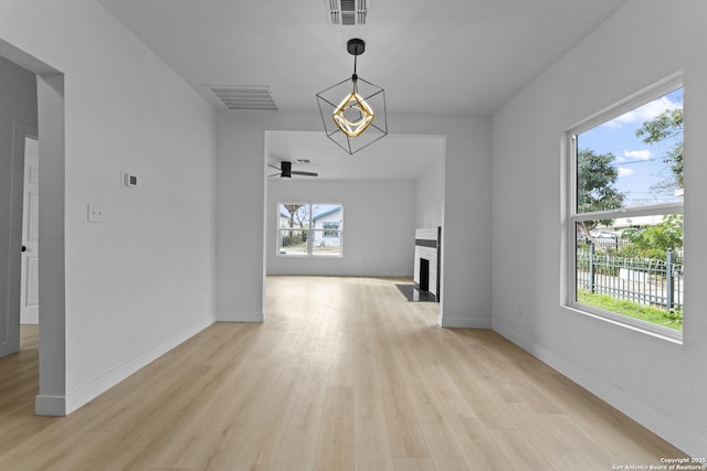 hall featuring light hardwood / wood-style flooring and plenty of natural light