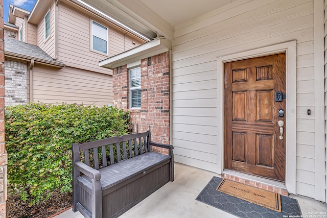 doorway to property featuring a porch