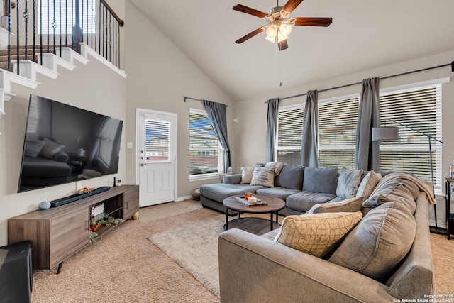 living room featuring ceiling fan and high vaulted ceiling