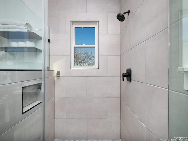 bathroom with a tile shower