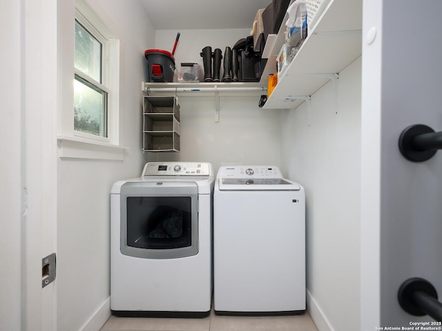 laundry area with separate washer and dryer