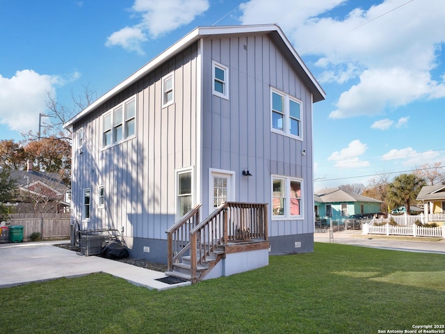 rear view of property with a patio area and a yard