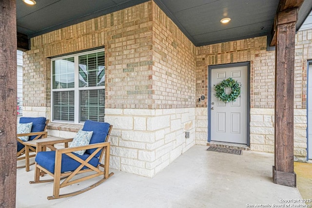 doorway to property featuring covered porch