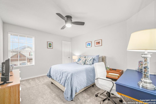 bedroom featuring light colored carpet and ceiling fan