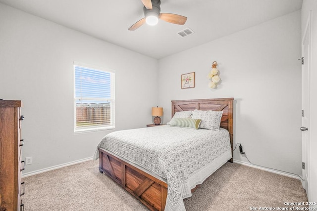 bedroom featuring ceiling fan and light carpet