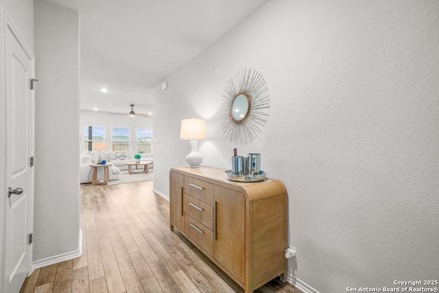 hall with light hardwood / wood-style flooring