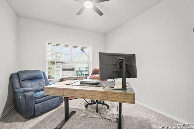 carpeted office space with ceiling fan