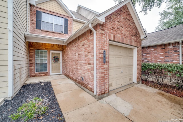 view of exterior entry featuring a garage