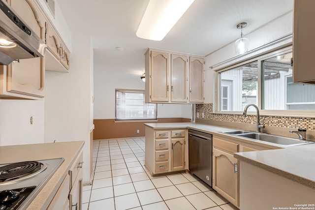 kitchen featuring stainless steel dishwasher, a healthy amount of sunlight, sink, and hanging light fixtures