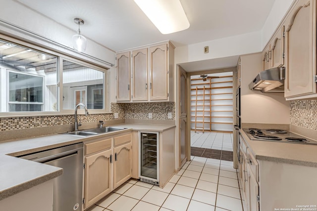 kitchen with backsplash, sink, light tile patterned floors, stainless steel appliances, and beverage cooler