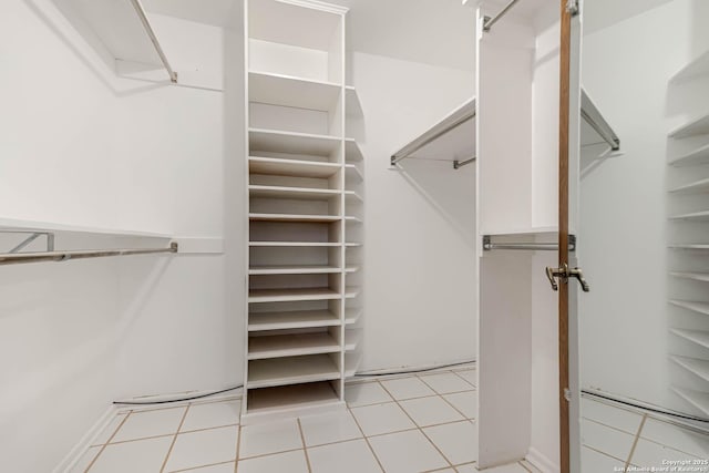 walk in closet featuring light tile patterned floors