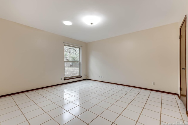 spare room featuring light tile patterned floors