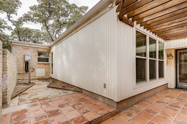 view of side of home featuring a patio area