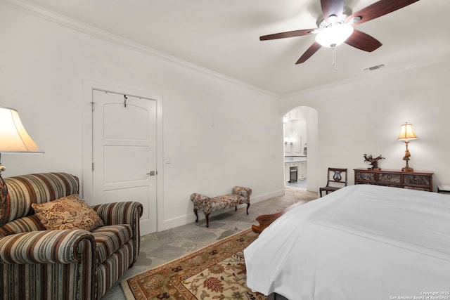 bedroom featuring connected bathroom, ceiling fan, and ornamental molding