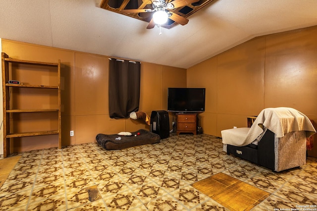 living room with ceiling fan and lofted ceiling