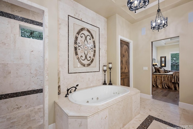 bathroom featuring ensuite bathroom, a walk in shower, baseboards, a jetted tub, and an inviting chandelier