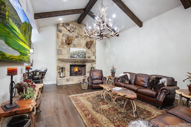 living area with vaulted ceiling with beams, baseboards, dark wood-style flooring, and a stone fireplace