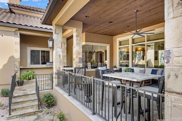 view of patio featuring a ceiling fan and outdoor dining area