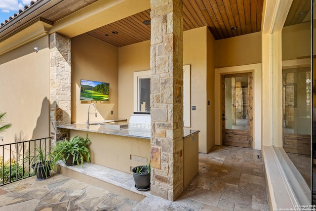 view of patio / terrace featuring a sink and area for grilling