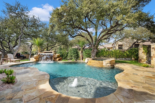 view of pool with a pool with connected hot tub and a patio