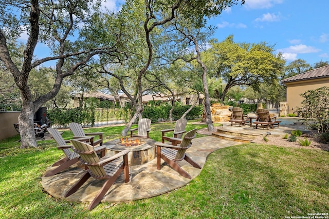 view of yard featuring a patio area and an outdoor fire pit