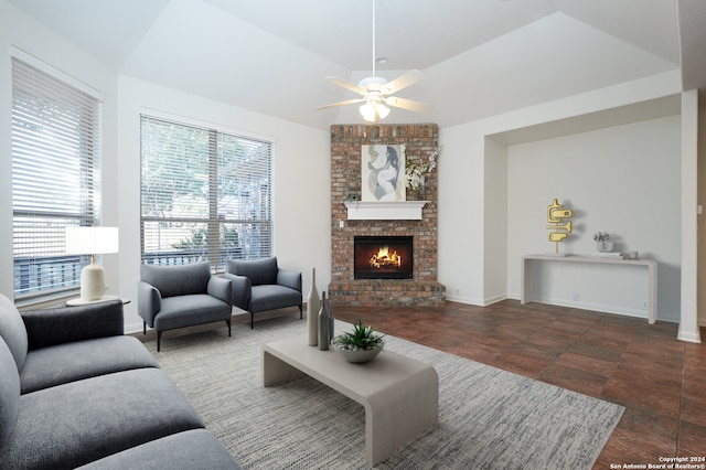 living room featuring ceiling fan, lofted ceiling, and a fireplace