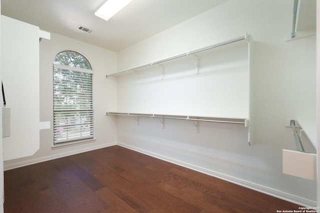 spacious closet featuring hardwood / wood-style floors