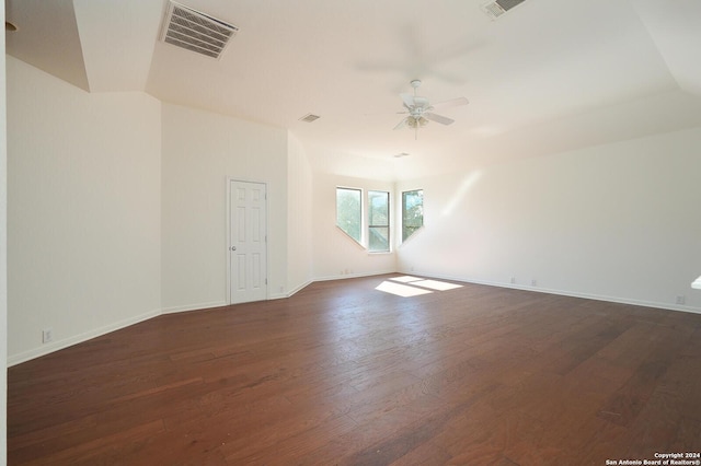 spare room with dark hardwood / wood-style floors and ceiling fan