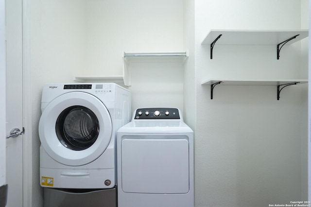 laundry area with independent washer and dryer