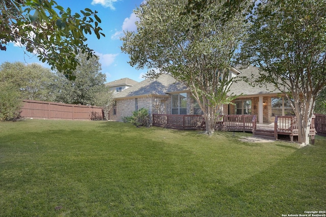 view of yard featuring a wooden deck