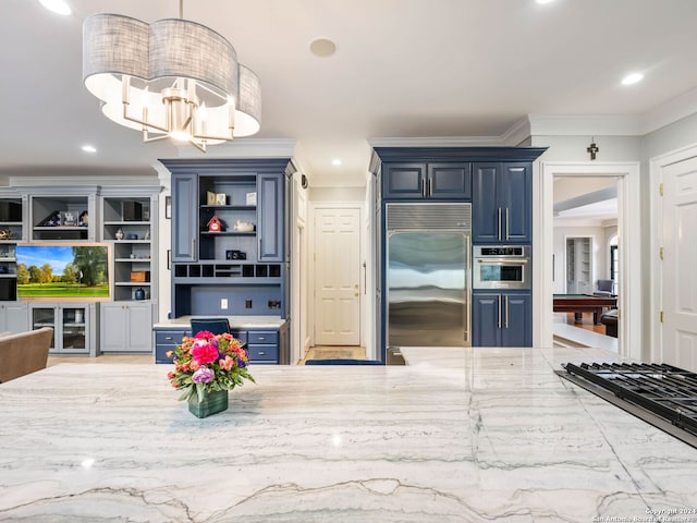 kitchen with blue cabinetry, ornamental molding, decorative light fixtures, and appliances with stainless steel finishes