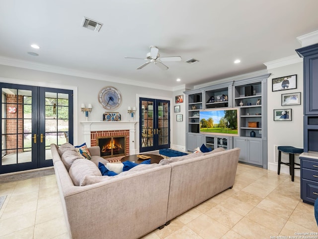 tiled living room featuring a fireplace, french doors, ceiling fan, and crown molding