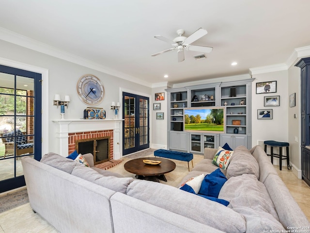 tiled living room featuring a fireplace, french doors, ceiling fan, and ornamental molding