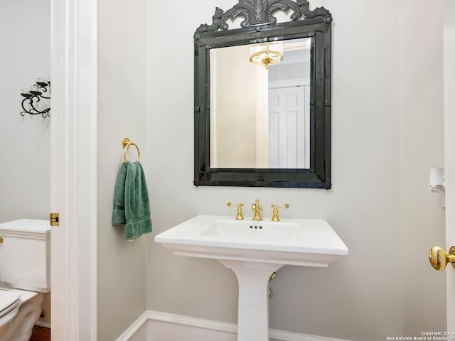 bathroom with sink and toilet