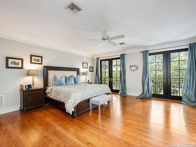 bedroom with french doors, light wood-type flooring, ornamental molding, access to outside, and ceiling fan