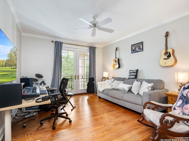 home office with ceiling fan, light wood-type flooring, crown molding, and french doors