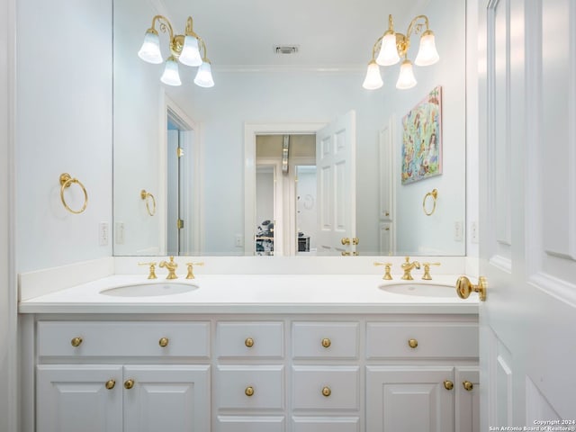 bathroom with vanity and crown molding