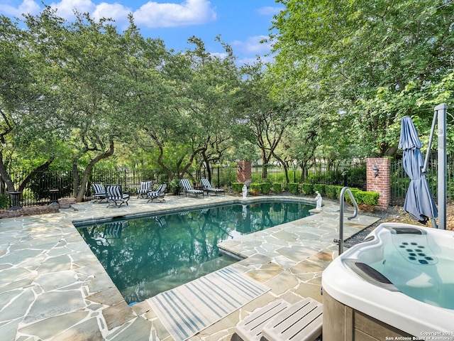 view of swimming pool featuring a patio area