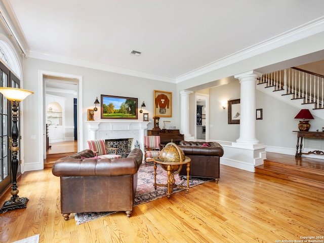 living room featuring light hardwood / wood-style flooring and ornamental molding